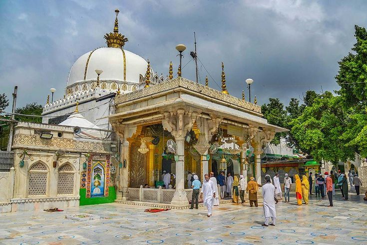 The majestic domes and intricate architecture of the revered Ajmer Dargah, a sacred pilgrimage site in Ajmer, Rajasthan, surrounded by devotees paying homage to the Sufi saint Hazrat Khwaja Moinuddin Chisht