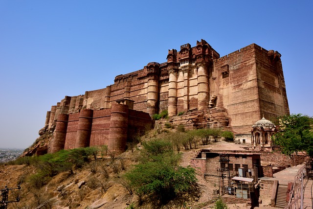 A majestic view of the historic Mehrangarh Fort, showcasing its towering walls, intricate architecture, and panoramic surroundings