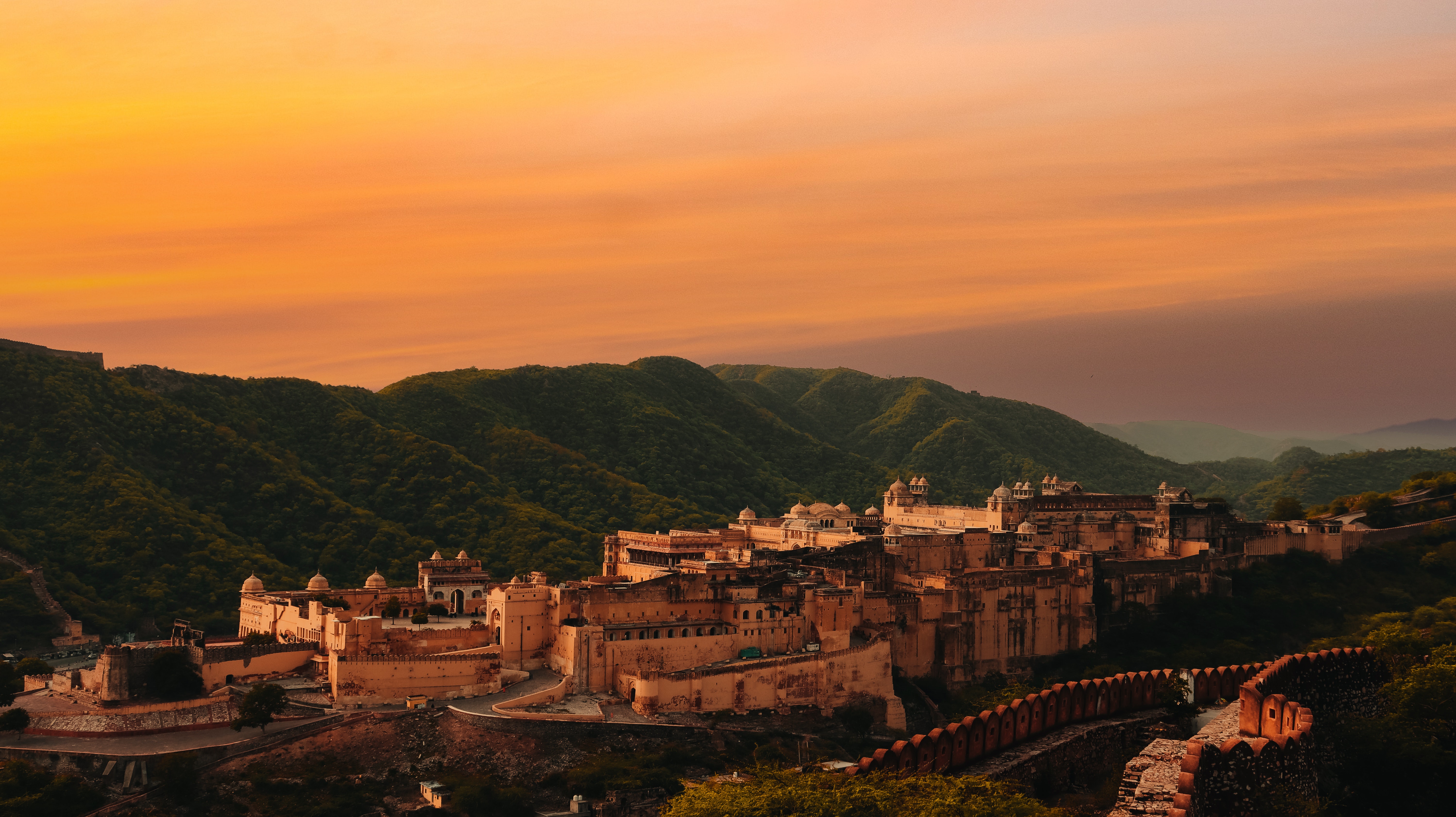 A captivating evening view with the fort illuminated and a stunning red sky,