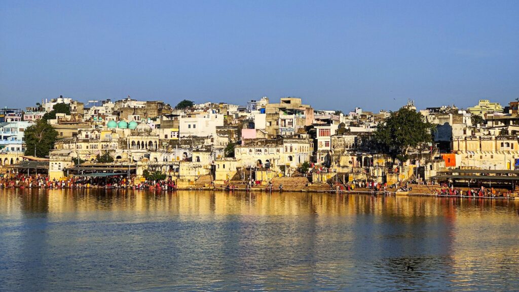 A serene view of Pushkar Ghat, the sacred bathing ghats along the Pushkar Lake in Rajasthan, India, known for their religious and cultural significance