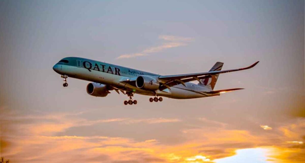 An aerial view of an airplane flying over cityscapes, symbolizing air travel as a convenient mode of transportation to reach Jaipur, offering a bird's-eye perspective on the journey to this vibrant city.