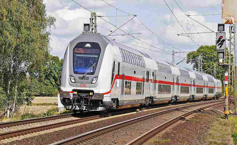 Train traveling on tracks towards Jaipur, symbolizing transportation options for reaching the city