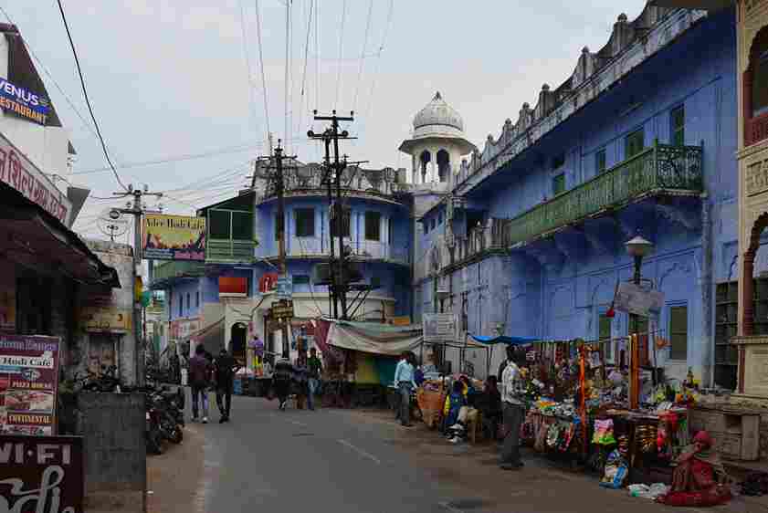 In the serene morning atmosphere of Pushkar, vendors are meticulously arranging their stalls, preparing for the bustling day ahead.