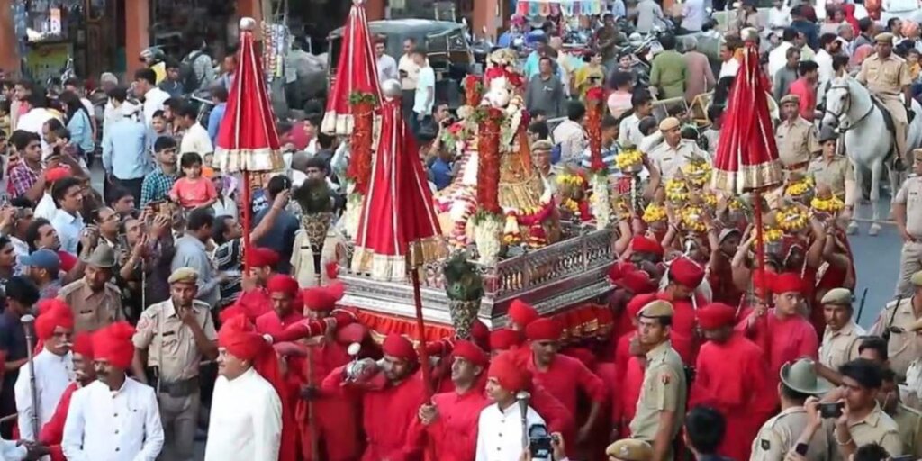 Gangaur procession featuring beautifully adorned idols, a cultural spectacle during the Gangaur festival celebration in Rajasthan