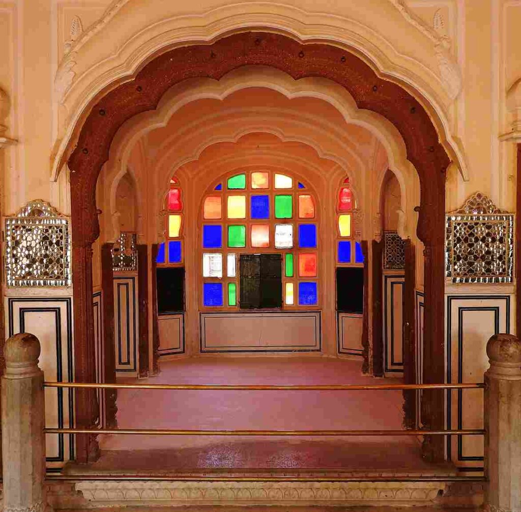 Colorful stained glass windows inside Hawa Mahal, adding vibrancy to the historic architecture. Image credit: Google.