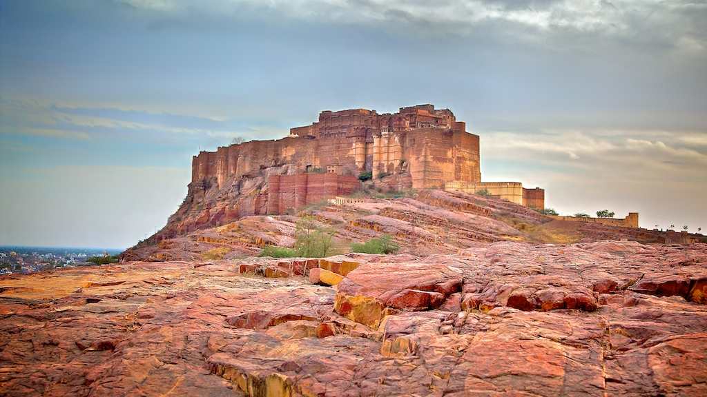 Lonely silhouette of Mehrangarh Fort atop a rocky hill in Jodhpur, Rajasthan, captured from Flickr.