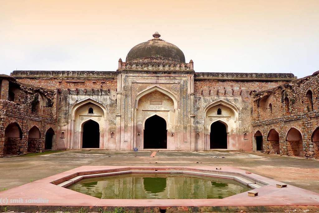 Khairul Manazil Masjid" - A serene mosque nestled amidst narrow lanes, featuring domes and intricate calligraphy, embodying the architectural elegance of Old Delhi.