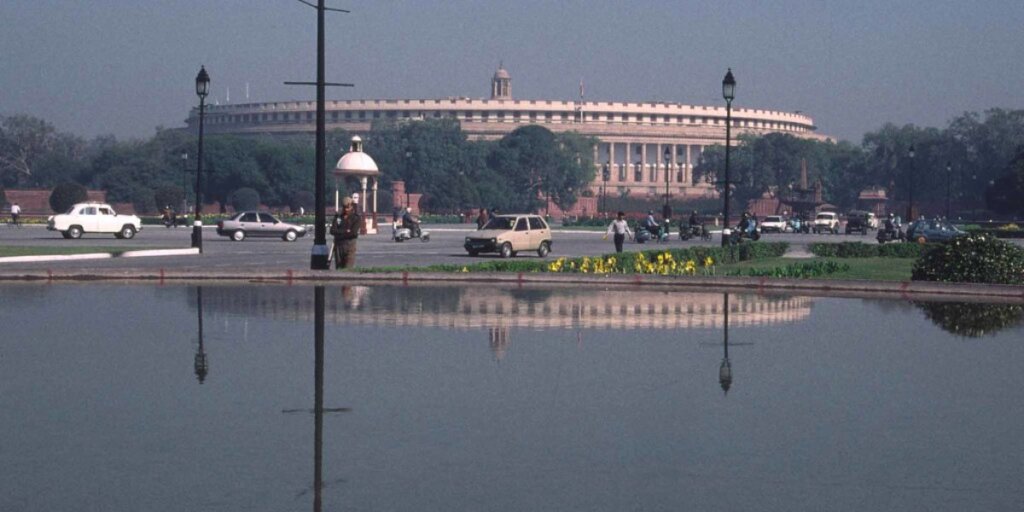 Outer view of Parliament, New Delhi - Image by Flickr: A striking perspective capturing the architectural grandeur of India's Parliament building