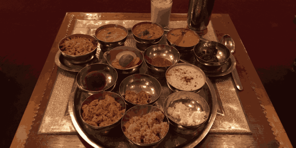 Traditional Rajasthani thali featuring Dal Bati Churma, a flavorful dish, beautifully captured by Wikimedia Commons photographer