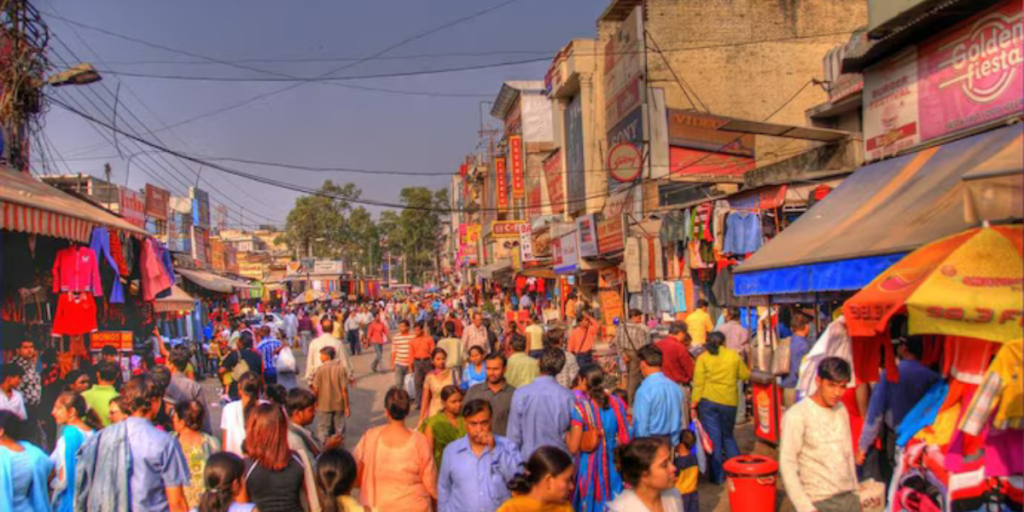  A bustling market in Delhi, India, filled with colourful stalls, people, and vibrant energy.