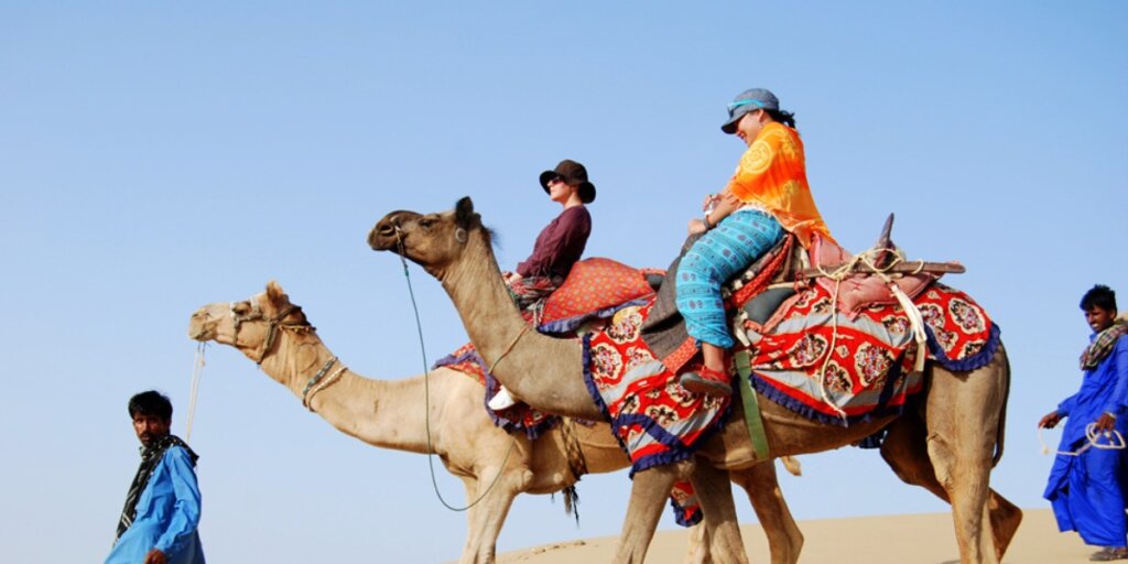 "Camel safari adventure in Jaisalmer, captured in a stunning image. Image credit: Flickr."