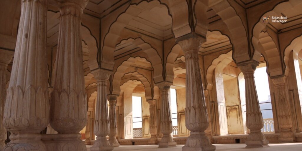 An expansive view inside City Palace Jaipur, showcasing numerous pillars in a grand hall. Image sourced from Google.