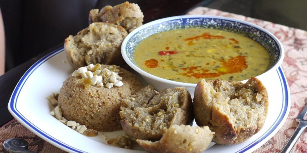 Plate of Dal Bati Churma, a traditional Rajasthani dish, beautifully presented. (Image credit: Flickr)