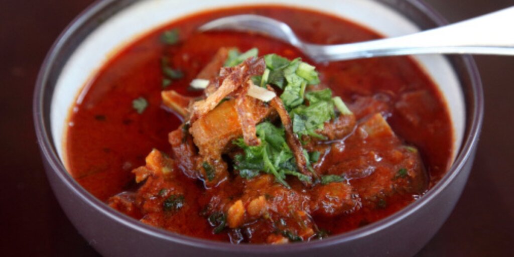 Delicious Lal Maas, a traditional Rajasthani dish, beautifully presented. Image credit: Google