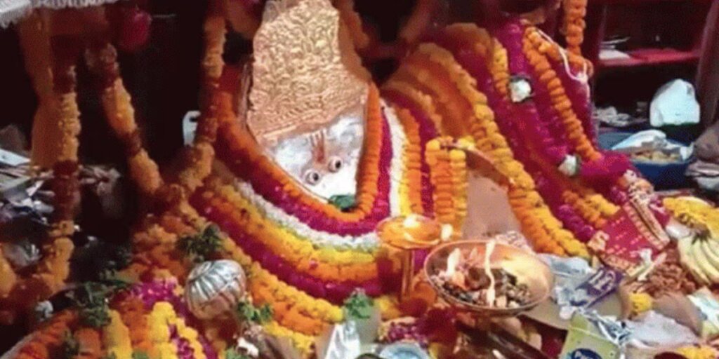 A statue of Lord Hanuman in Pandupol, Alwar, surrounded by serene natural surroundings, representing spirituality and tranquility.