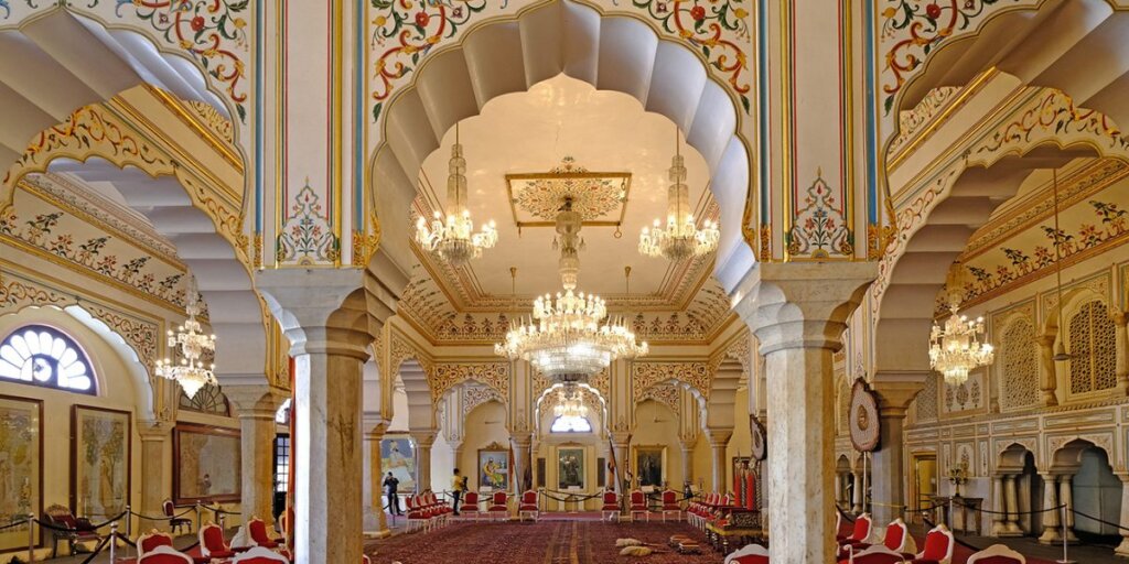 Interior view of the City Palace in Jaipur, Rajasthan, showcasing ornate architecture, intricate designs, and historical grandeur.