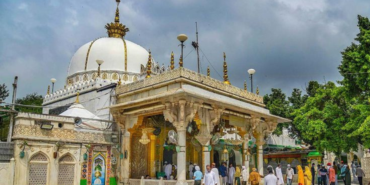 The majestic domes and intricate architecture of the revered Ajmer Dargah, a sacred pilgrimage site in Ajmer, Rajasthan, surrounded by devotees paying homage to the Sufi saint Hazrat Khwaja Moinuddin Chisht