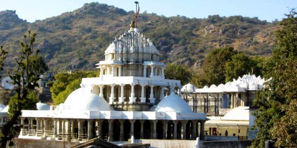 Dilwara Jain Temple, Mount Abu - A magnificent white marble temple complex surrounded by lush greenery.