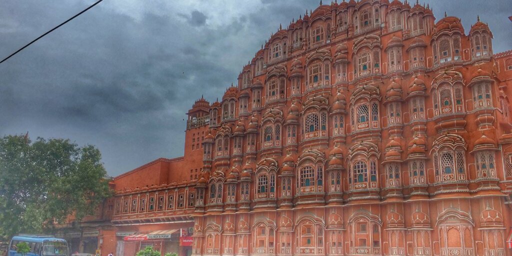 Image of Hawa Mahal, a historic palace in Jaipur, India, with its distinctive honeycomb-like facade, captured from Wikimedia Commons