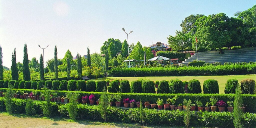 Image of Peace Park in Mount Abu, Rajasthan, featuring beautifully landscaped gardens with lush greenery and rows of plants.