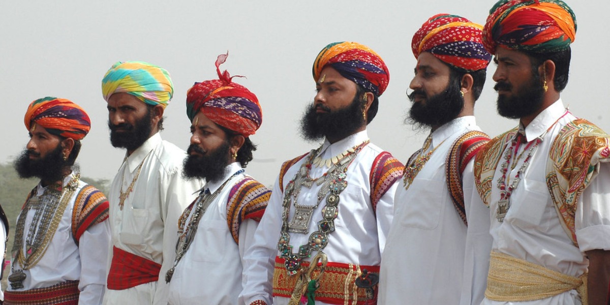 A Rajasthani man in traditional dress standing in Jaisalmer. Get this image on: flickr.com | License details | Creator: Public.Resource.Org | Credit: Ajo, Amrit, San, Dpk