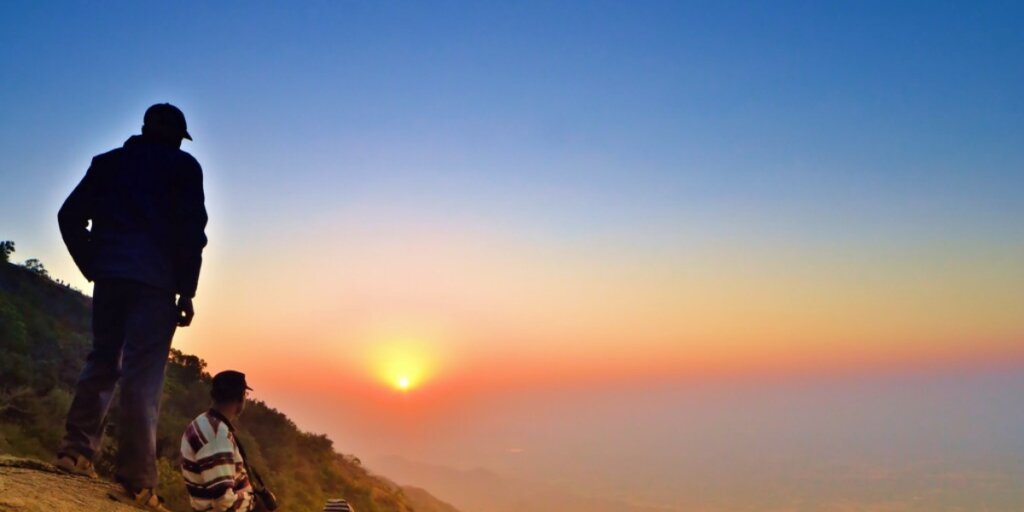 Image of Sunset Point in Mount Abu, showcasing a vibrant red sky, ideal for relaxation and enjoying image by Flickr