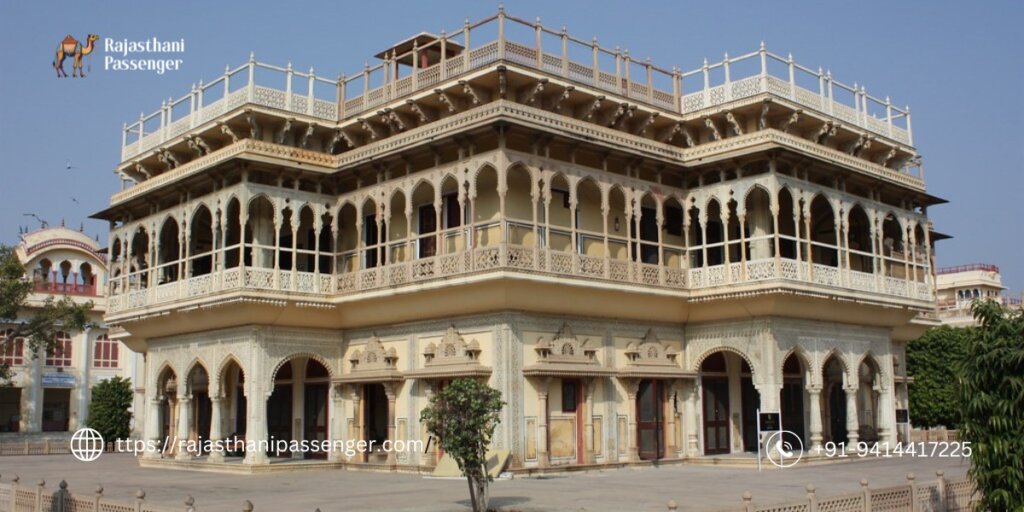 Exterior view of City Palace Jaipur, showcasing intricate Rajput architecture against a backdrop of clear blue sky, captured during a sunny day.